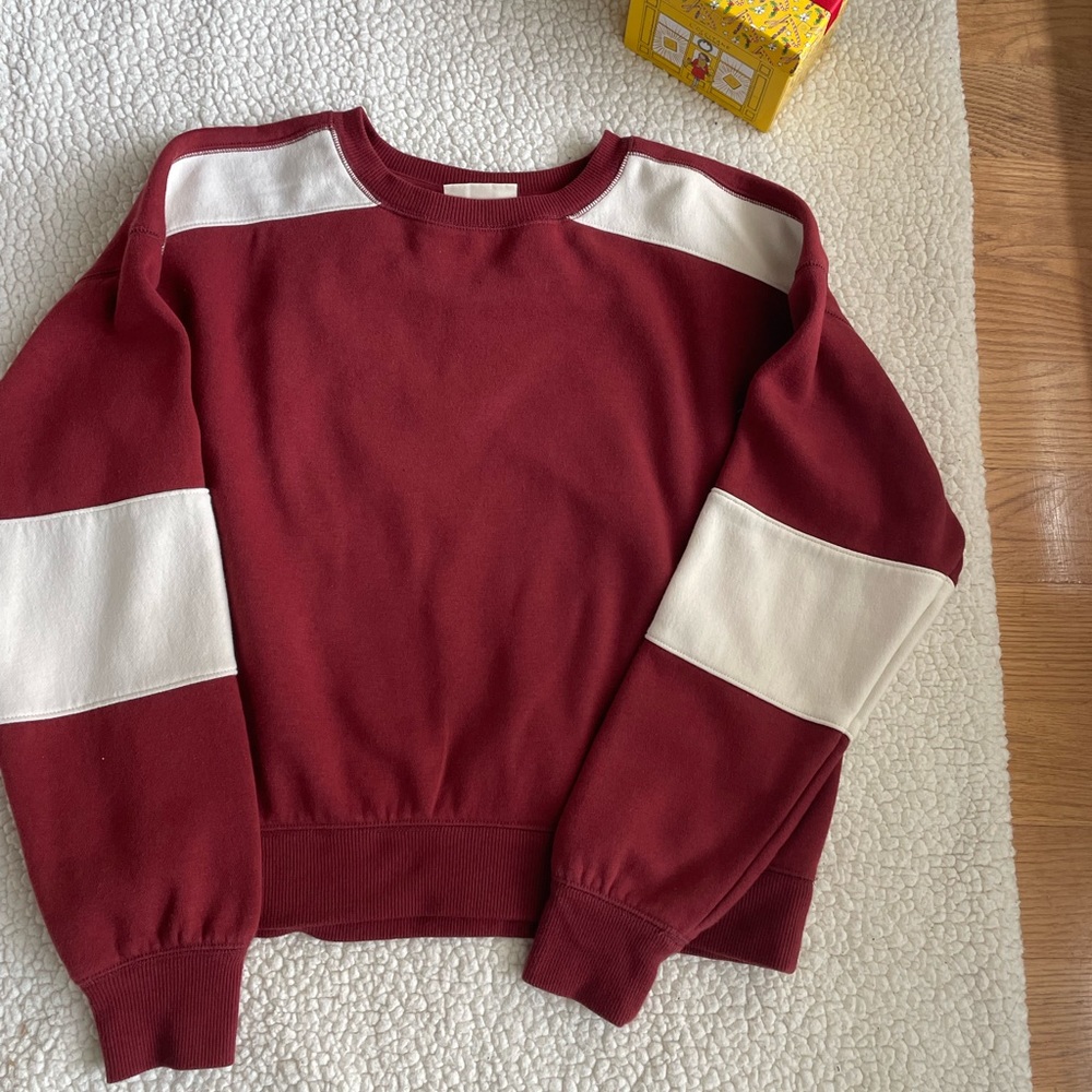 Dark red color sweatshirt .